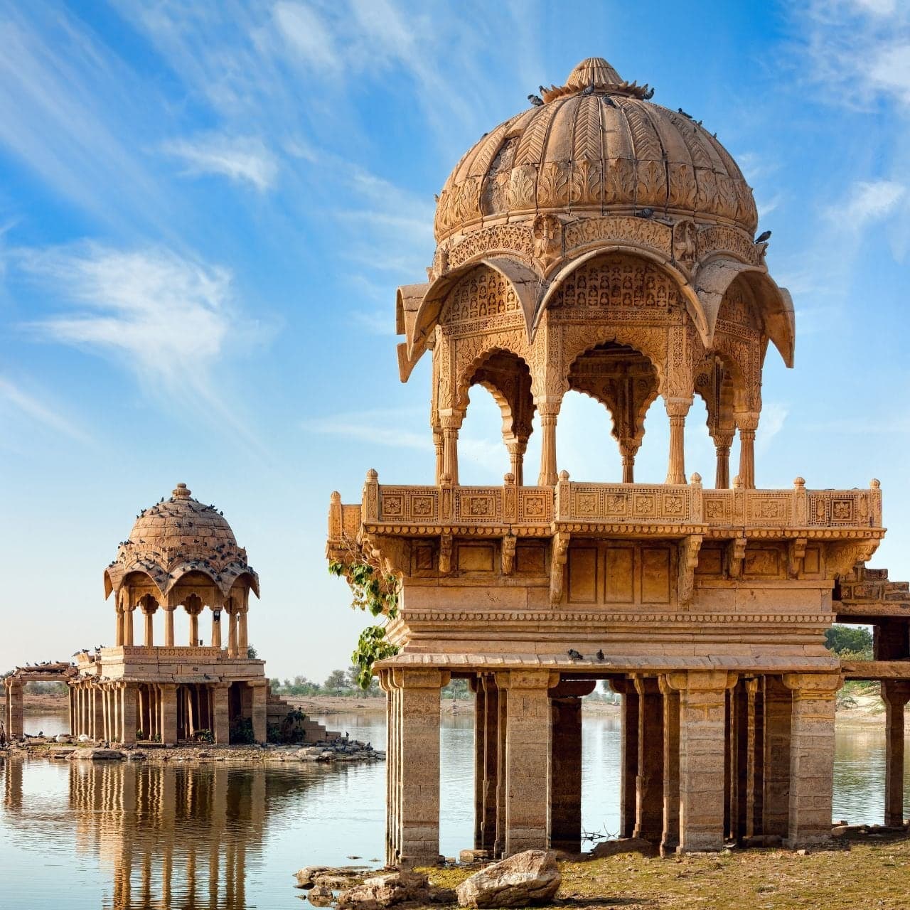 Carved sandstone chhatris on the shore of Gadisar Lake in Jaisalmer