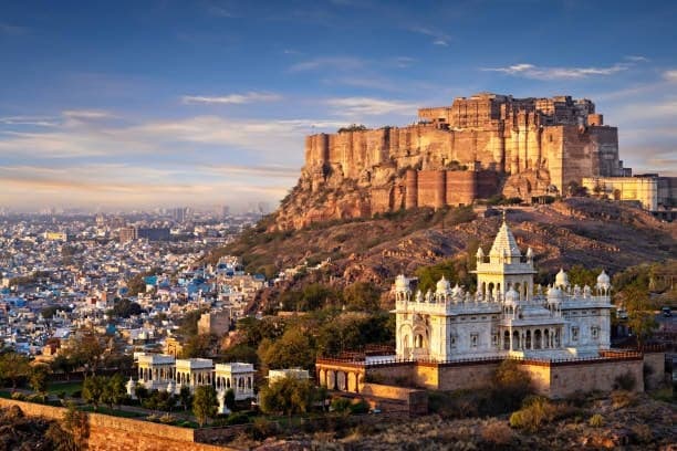 Mehrangarh Fort above the blue houses of Jodhpur, with the white marble Jaswant Thada below